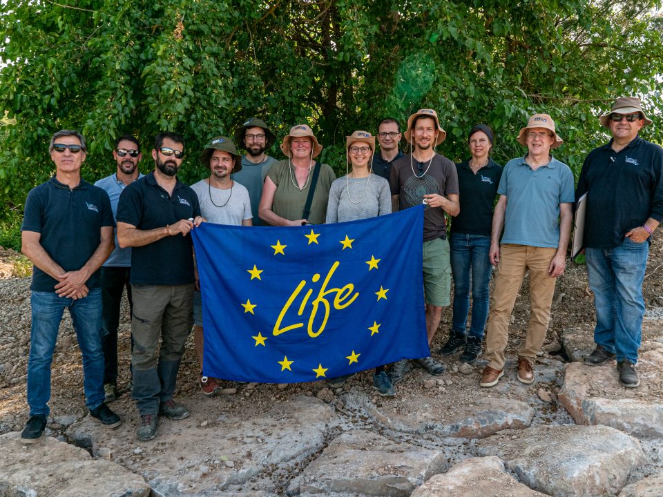 Visit IRIS Austria project. Group photograph with LIFE flag.